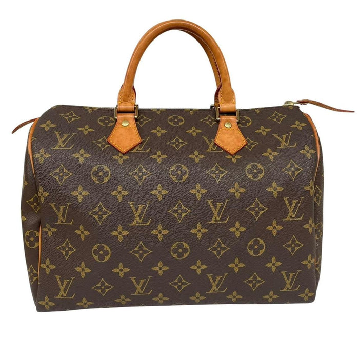 Louis Vuitton duffel bag beige and brown monogram coated canvas with leather trim.