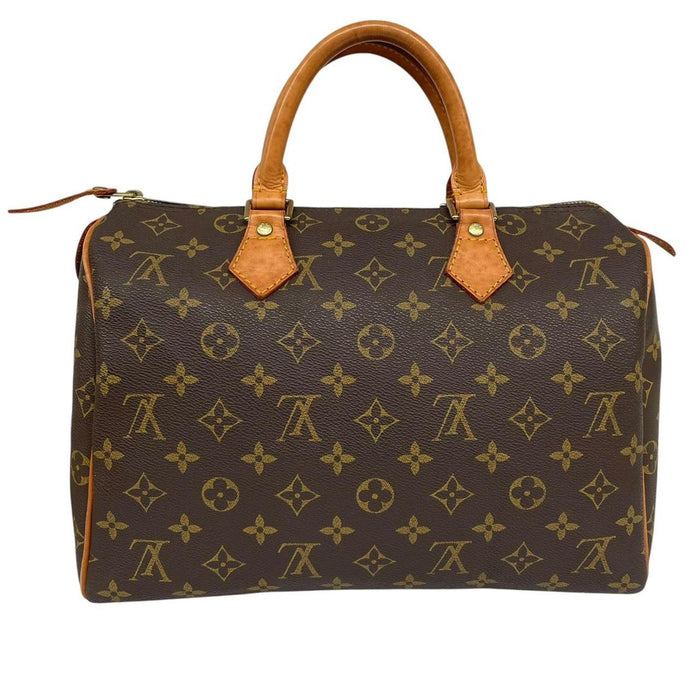 Louis Vuitton duffel bag beige and brown monogram coated canvas with leather trim.
