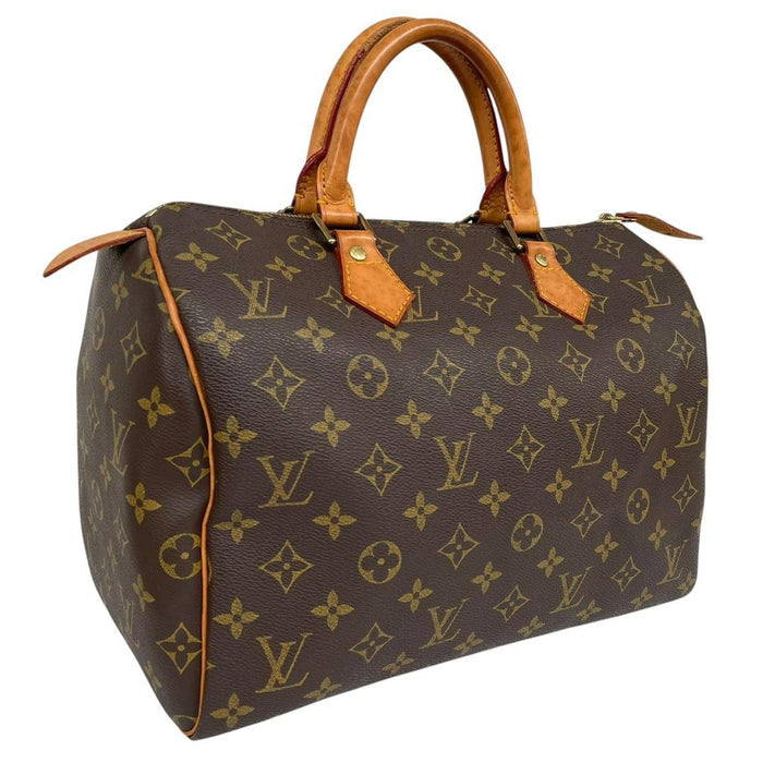 Louis Vuitton duffel bag beige and brown monogram coated canvas with leather trim.