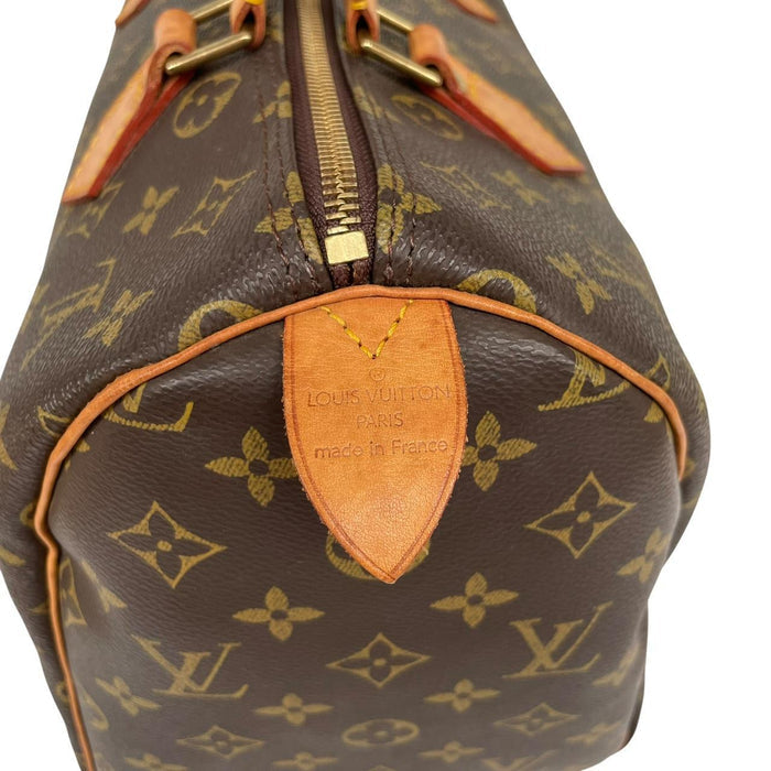 Louis Vuitton duffel bag beige and brown monogram coated canvas with leather trim.