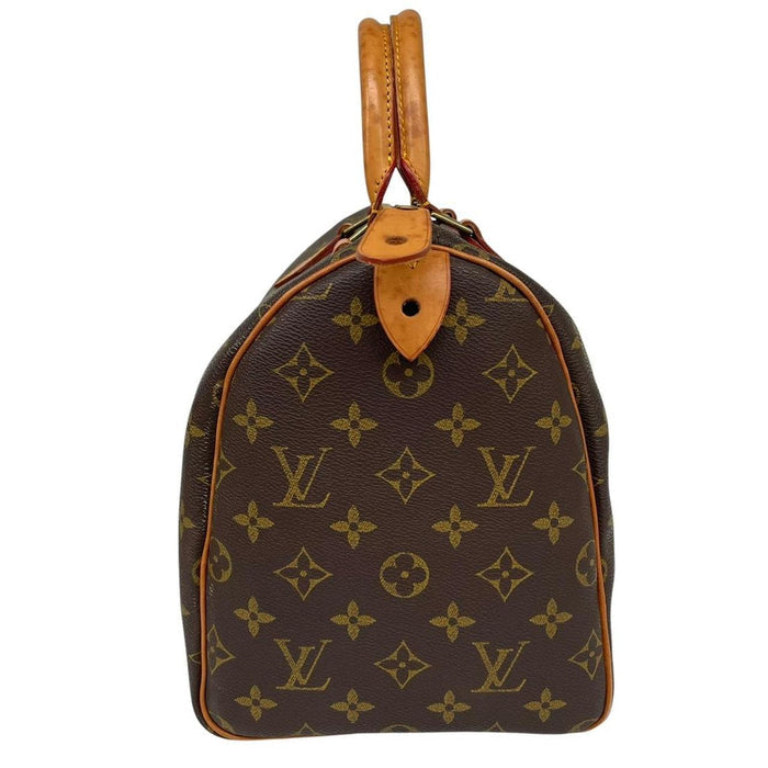 Louis Vuitton duffel bag beige and brown monogram coated canvas with leather trim.