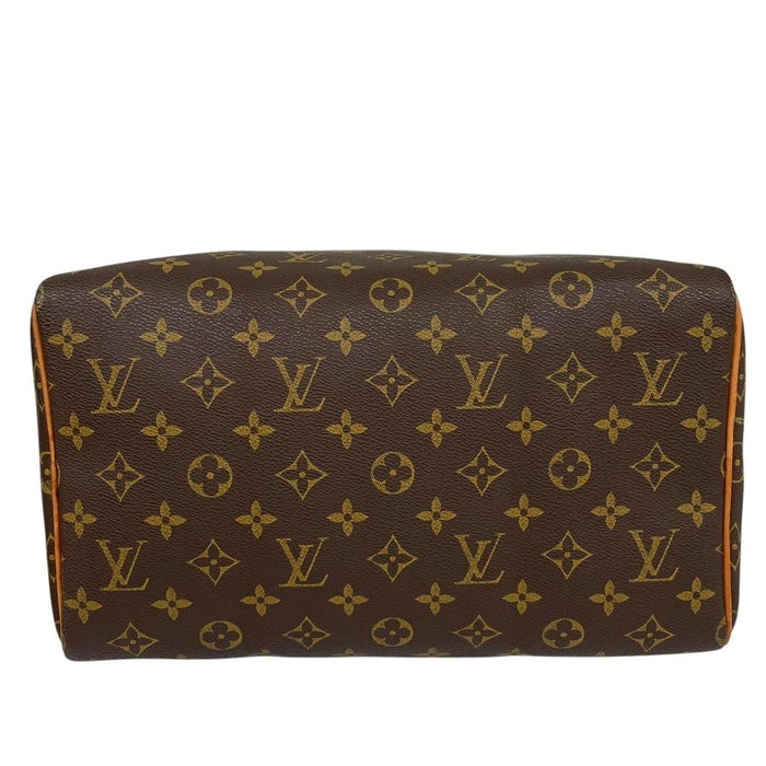 Louis Vuitton duffel bag beige and brown monogram coated canvas with leather trim.