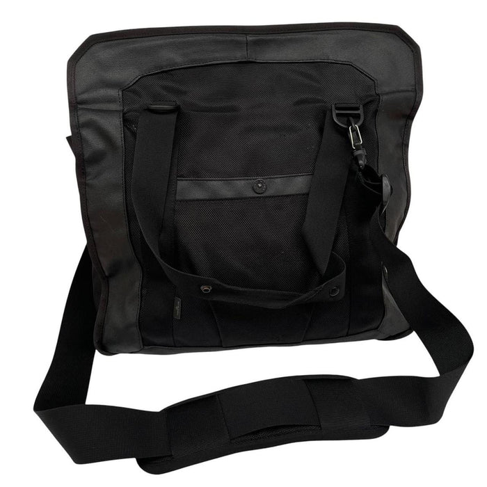 Stone Island black nylon tote bag with logo patch and crossbody strap.
