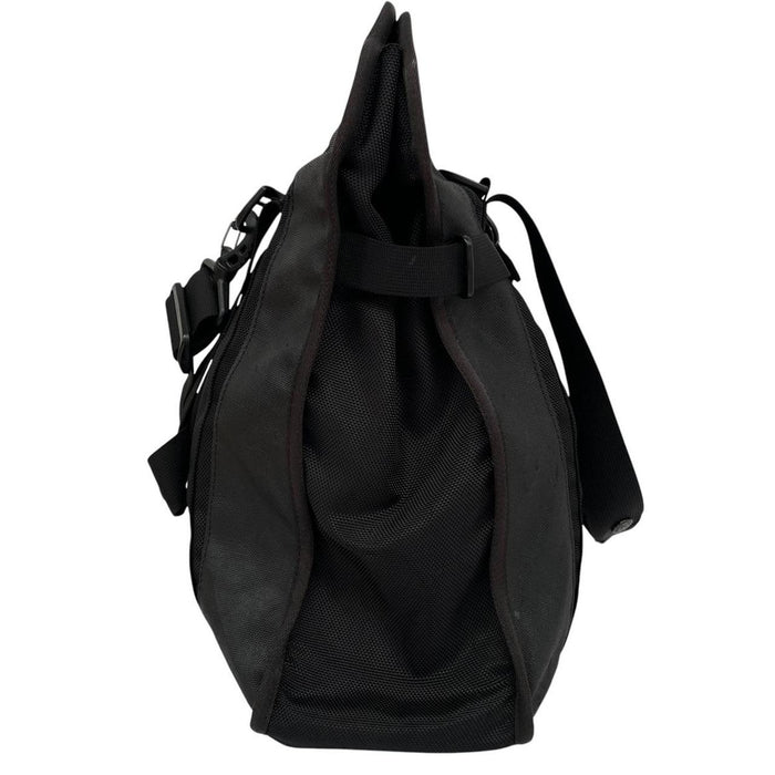Stone Island black nylon tote bag with logo patch and crossbody strap.