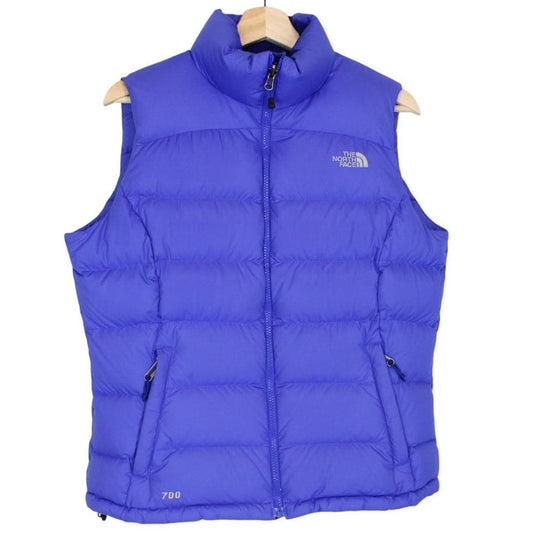 The North Face blue down gilet with logo detail and quilted pattern.