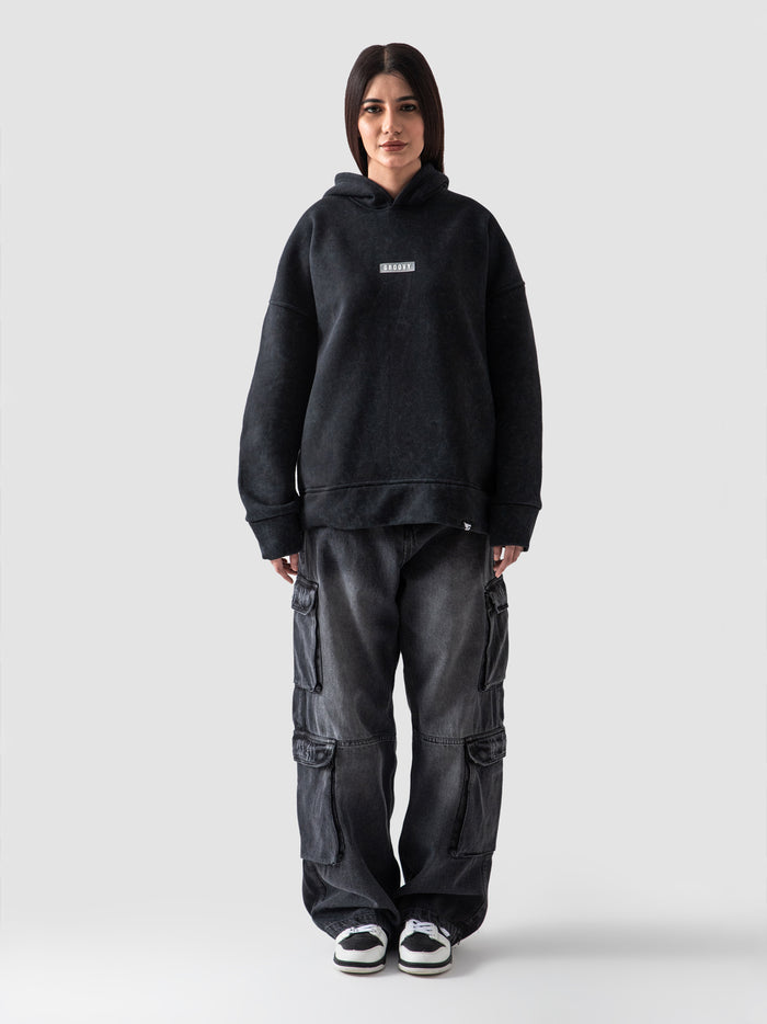 Washed black oversized hoodie male model full body front view Pakistan – GROOVY