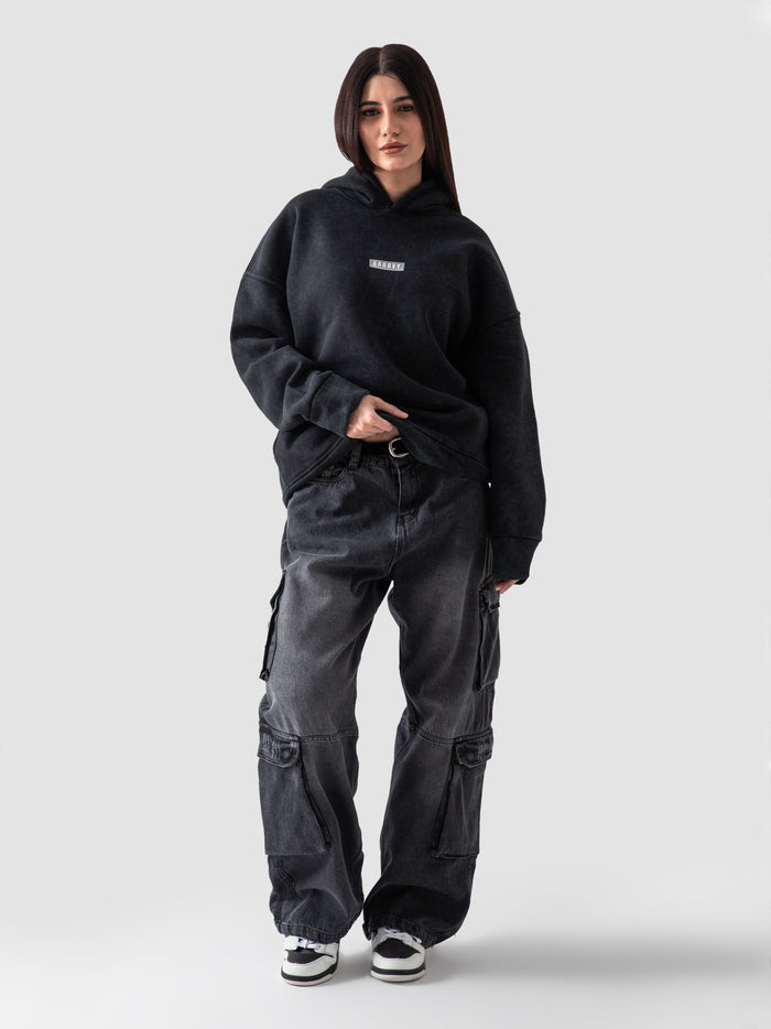 Washed black oversized hoodie couple lifestyle shot streetwear Pakistan – GROOVY