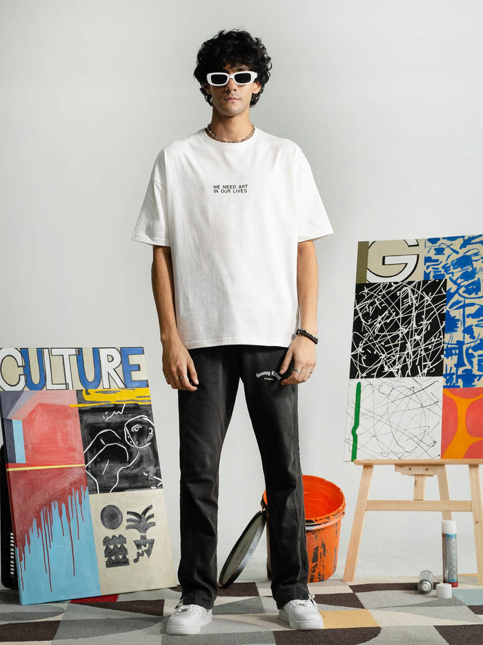 Pearl White Tee Couple Lifestyle Shot – We Need Art In Our Lives – GROOVY Pakistan