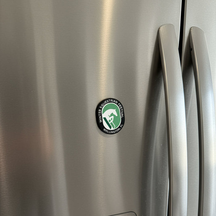 winter equestrian festival magnet on a refrigerator