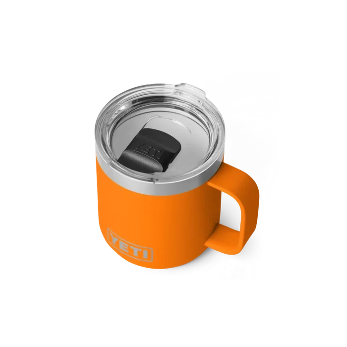 Orange YETI insulated mug with handle and clear lid, ideal for watersports adventures in Whitstable